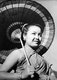 Laos: Young Lao woman with a parasol, French Indochina, c. 1930s